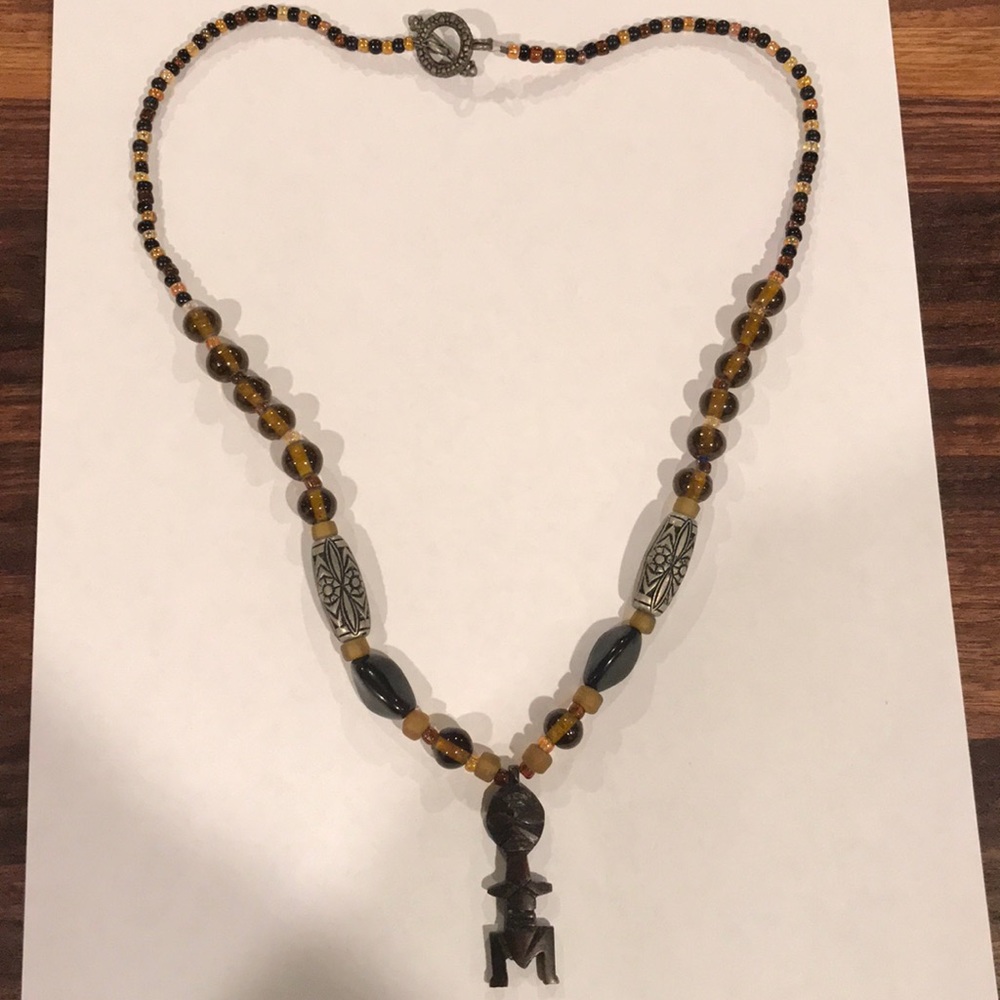 Vintage amber-beaded wooden tiki man necklace